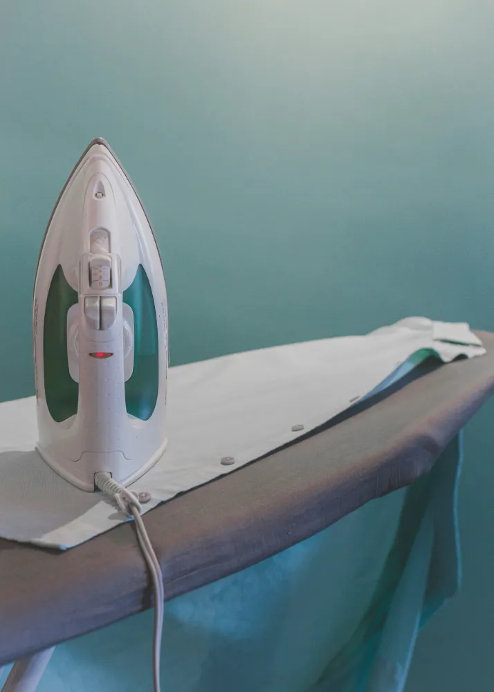 Iron on top of an ironing board